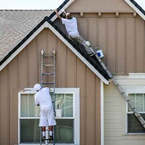 Clark County Painting contractors painting the facade of a house in Vancouver WA